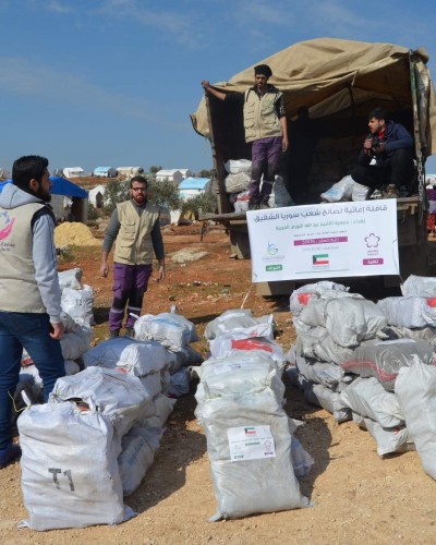 توزيع البيرين في مخيم حربنوش ل350 عائلة